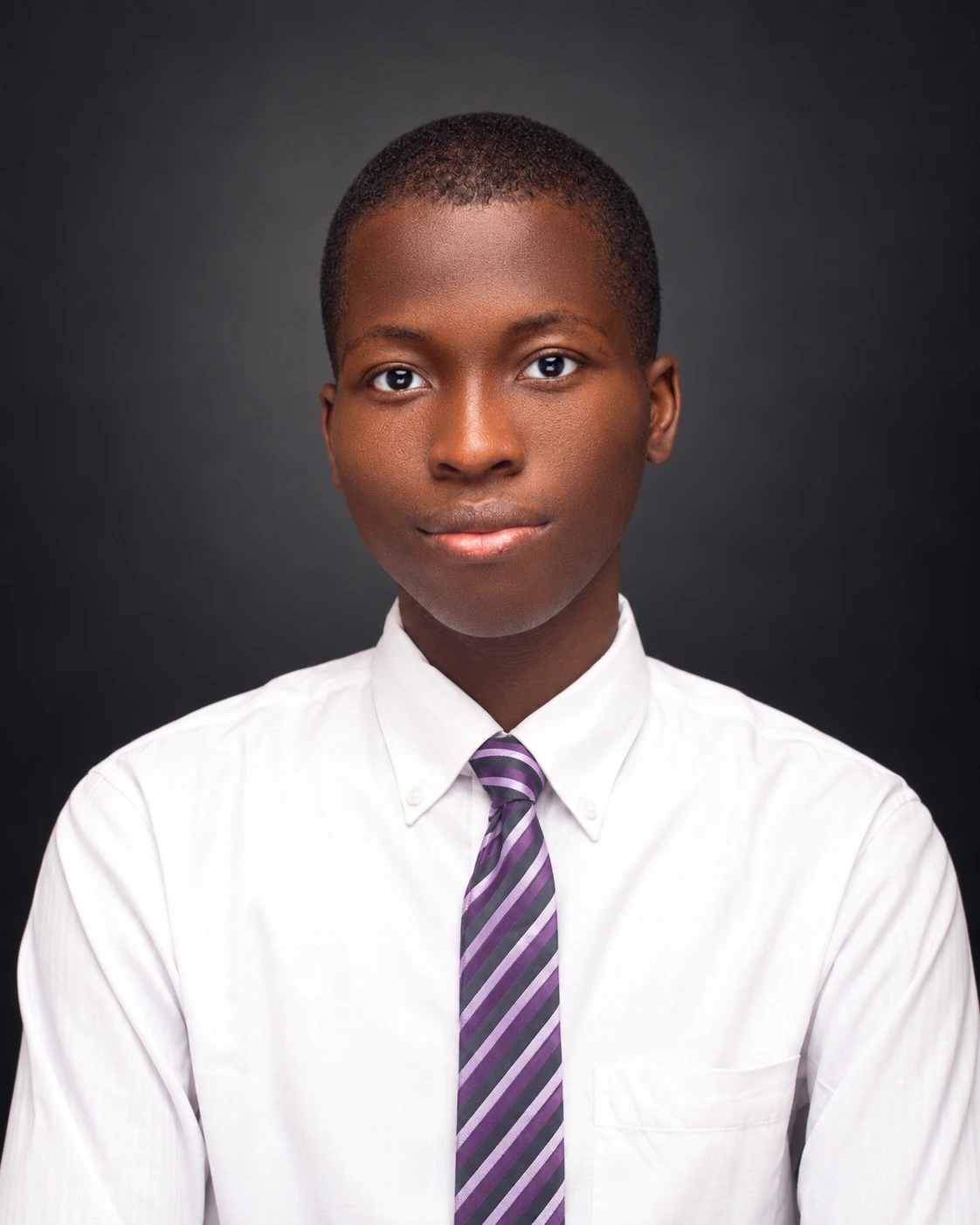 Samuel Ifeoluwa Akanni wearing a white shirt and purple tie